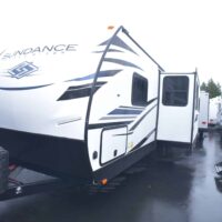 2022 HEARTLAND “Snake River” edition Sundance 262 RB trailer. ***One Only at This Price*** This is the huge bathroom floor plan. Plenty of room to get out of the shower and get dressed. The floor plan features a queen bedroom with a solid door, a couch/dinette slide-out and (almost) walk-in pantry. The Sundance trailers have a 3-year structural warranty and are loaded with features including: enclosed and heated tanks, aluminum framing with laminated fiberglass sidewalls, “slam-latch” baggage doors, electric tongue jack, MorRide “step-above” entrance steps (500lb rated), fiberglass front cap, barreled interior ceiling (6’9” overall height) and prepped for solar and backup camera.