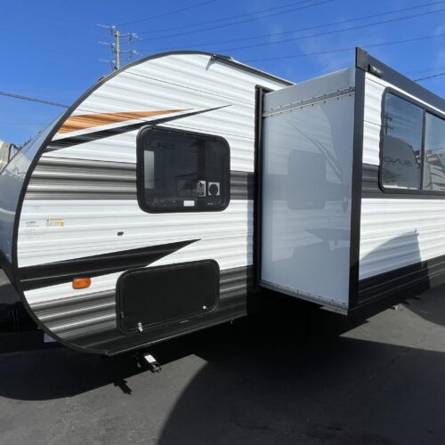 2023 FOREST RIVER WILDWOOD FSX 280RT Toy Hauler Trailer with Solar Panel. From Forest River's best selling Brand, Wildwood, comes this new Toy Hauler Trailer. The 280RT packs a lot of features in a 32' trailer. First a separate garage with it's own entrance door, an 11' cargo floor that is 93" wide and has a 78" high door. The ramp is equipped with the patio fence so you can "kick back" after a long day riding and enjoy the outdoors. The living area features a queen size Murphy Bed, U-shaped dinette slide-out, fireplace, TV, 10cu. ft. DC refrigerator with a roof mounted solar panel, and lots of counter space. The mid bathroom has doors from the living room and the garage. The trailer only weighs about 6,200lbs and is just over 32' long.