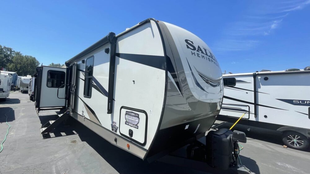 From one of Forest River's most popular brands, we have this 2022 Salem Hemisphere 308RLThree Slide Travel Trailer. This trailer offers a huge living room/kitchen with 2 big slide-outs, 2 recliner chairs across from the TV, an island kitchen with a huge floor to ceiling pantry. The bedroom features a king size bed on a slide out and a full front closet. All the room and utility of a fifth wheel in a tow behind trailer!