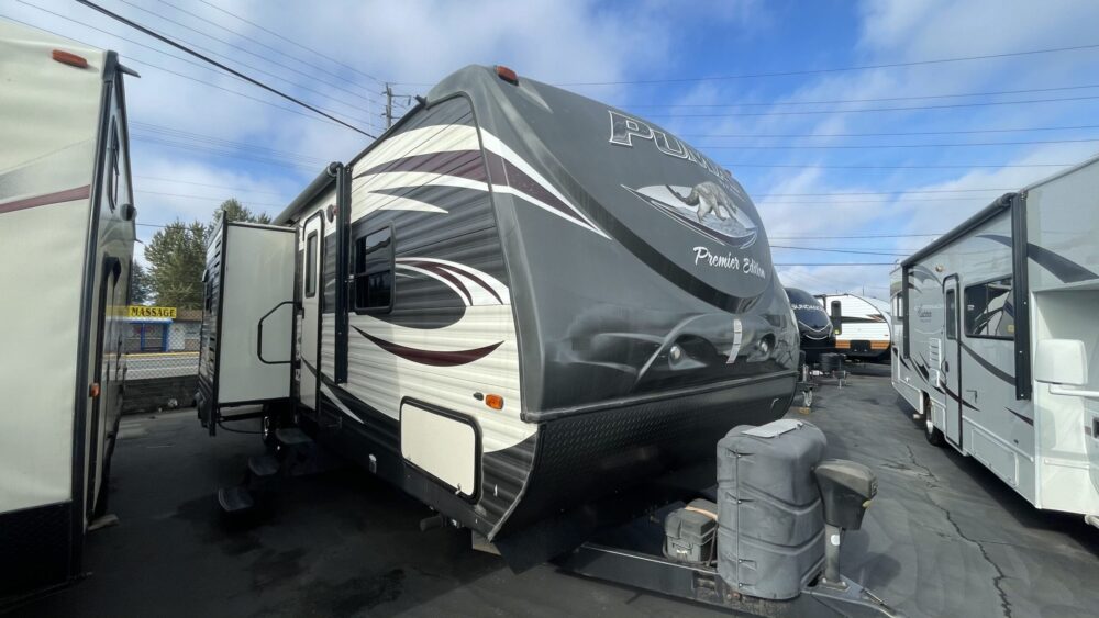 2015 Palamino Puma Premier Edition 29RBKS. This Puma is a great bunk house floor plan. The 29RBKS features 2 slide-outs in the middle of the trailer, a couch/ U-shaped dinette slide out and a kitchen slide out across. In between you have an island kitchen sink. The back features 2 "double size" bunk beds and a bathroom with a separate door to the outside. The front has a spacious island bedroom.