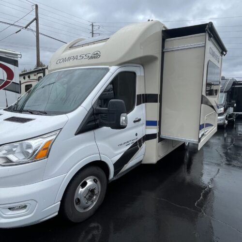 2022 THOR MOTOR COACH COMPASS AWD 23TE Motor Home. This is a slightly used Compass AWD 23TE. Thor's all wheel drive class-C motorhome. This unique little motorhome is only 90" wide and under 24" long, but sports a queen size Murphy style bed in the couch/Murphy bed slide-out. The Compass is built on the Ford Transit 350HD AWD chassis and powered by a 3.5L V6 eco-boost turbo gas engine with 310HP and 400 lb-ft of torque. It features a towing capacity of 5,000 lb. The Compass is loaded with features like frameless windows, stereo/navigation with 8" multifunction screen, heated remote mirrors, rear view mirror w/ a backup monitor built in, swivel driver/pass chairs, 40" TV, 4.0 KW Onan generator, 100W solar panel, tankless water heater, heat pads on the holding tanks and lots more. With its small size and eco-boost 310hp engine the Compass is both agile in the parking lots and quick on the highway. Save thousands off a new price!
